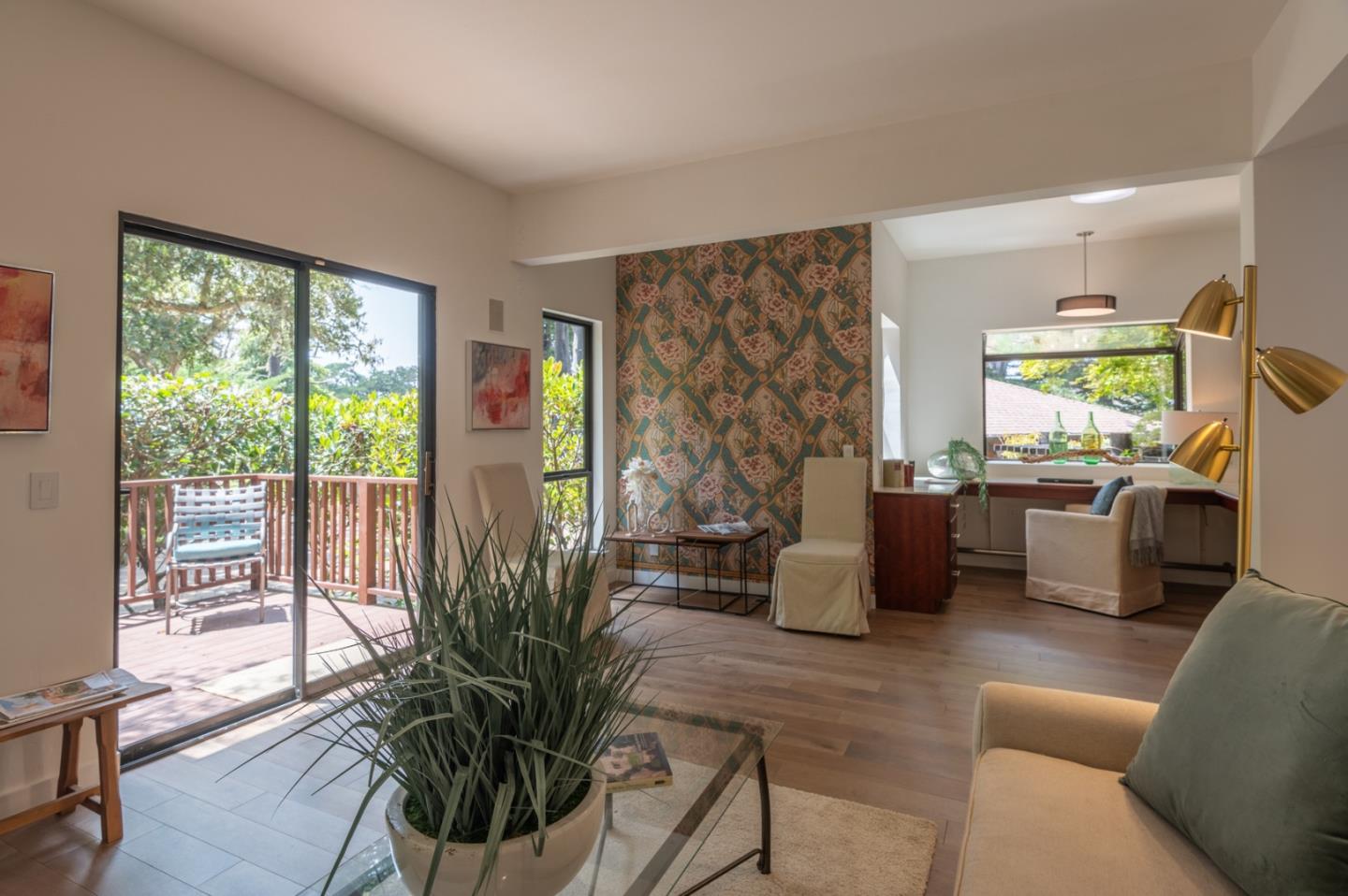 29705 Peter Pan Road Carmel, CA 93923 - Photo 24 of 51 a living room with furniture large windows and wooden floor
