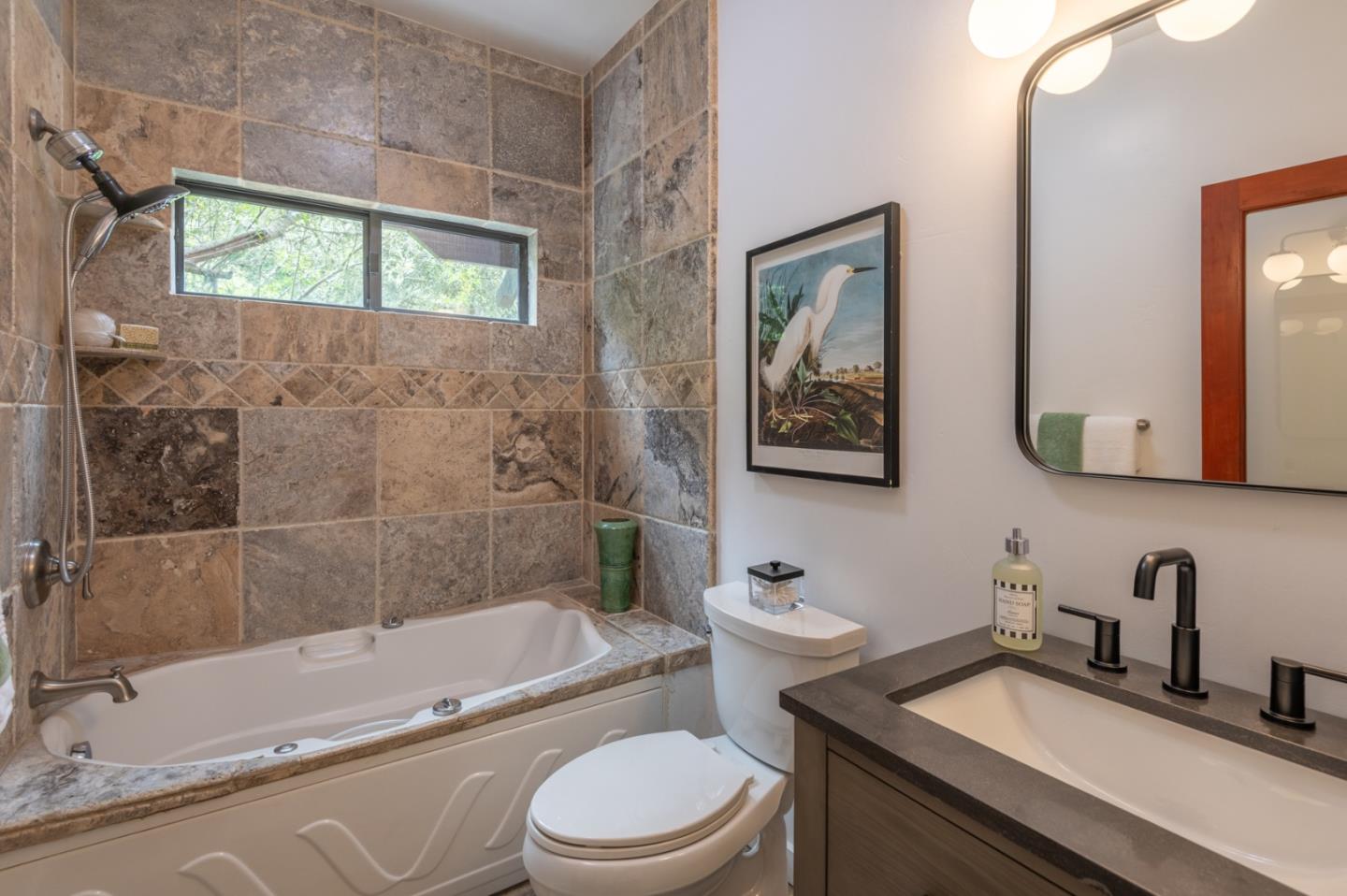 29705 Peter Pan Road Carmel, CA 93923 - Photo 28 of 51 a bathroom with a granite countertop toilet a sink and bathtub
