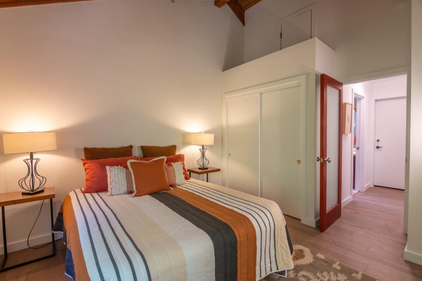 29705 Peter Pan Road Carmel, CA 93923 - Photo 30 of 51 a bedroom with a bed and a lamp