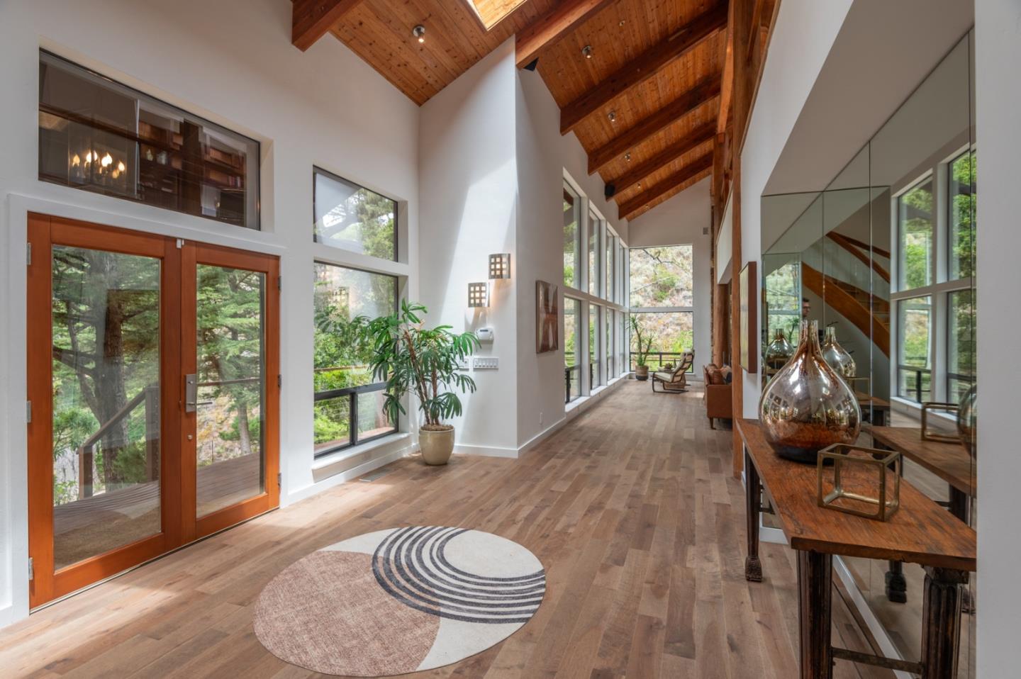 29705 Peter Pan Road Carmel, CA 93923 - Photo 3 of 51 a view of a livingroom with furniture window and wooden floor