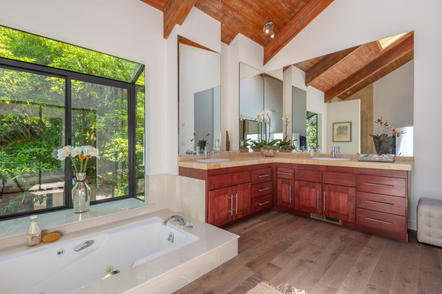 29705 Peter Pan Road Carmel, CA 93923 - Photo 33 of 51 a bathroom with a granite countertop tub sink and mirror