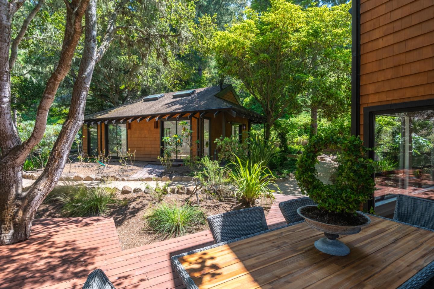 29705 Peter Pan Road Carmel, CA 93923 - Photo 41 of 51 a view of a house with backyard sitting area and garden