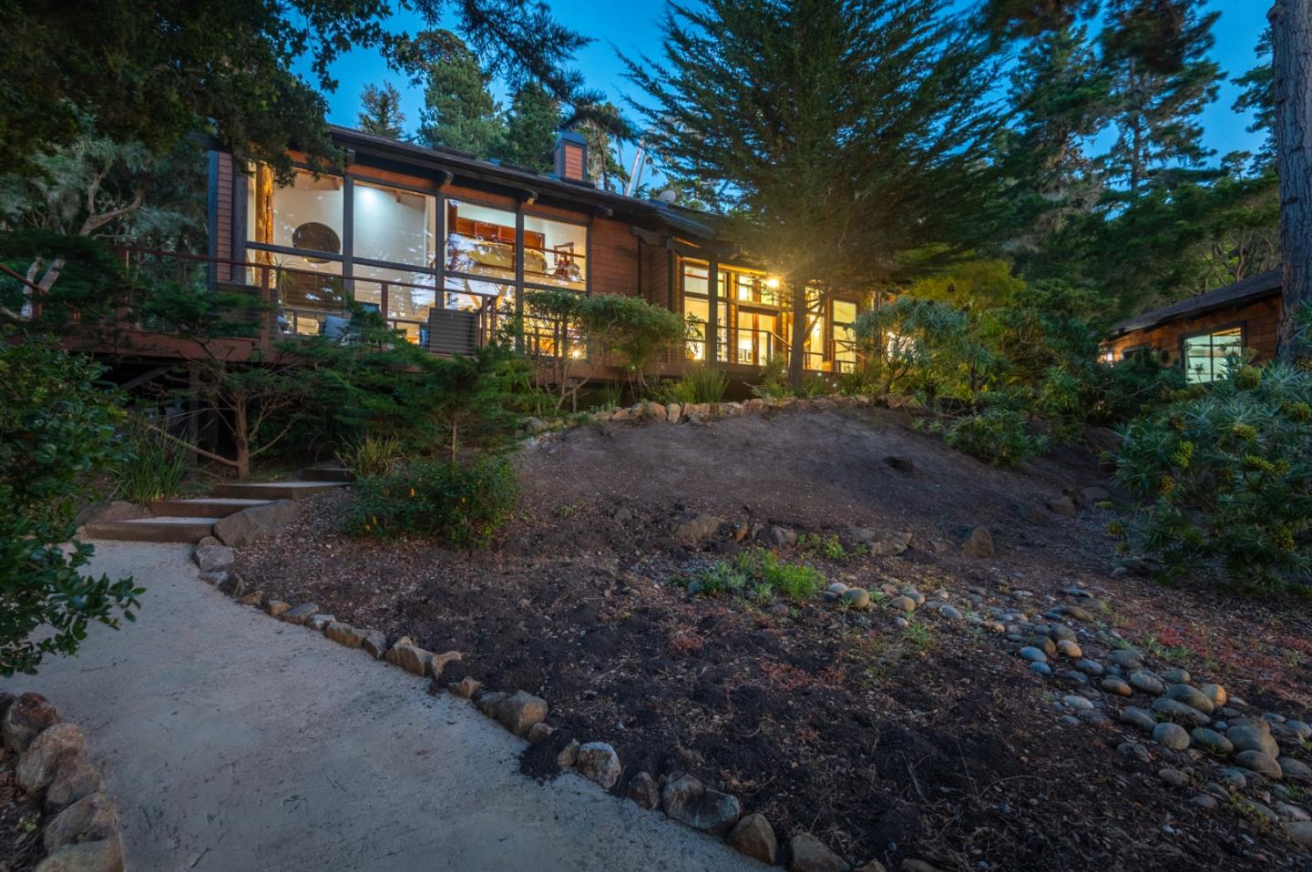 29705 Peter Pan Road Carmel, CA 93923 - Photo 48 of 51 a front view of a house with plants and trees