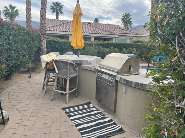 a patio with table and chairs