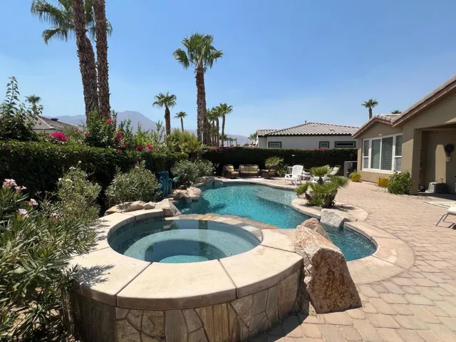 a view of a swimming pool with a patio