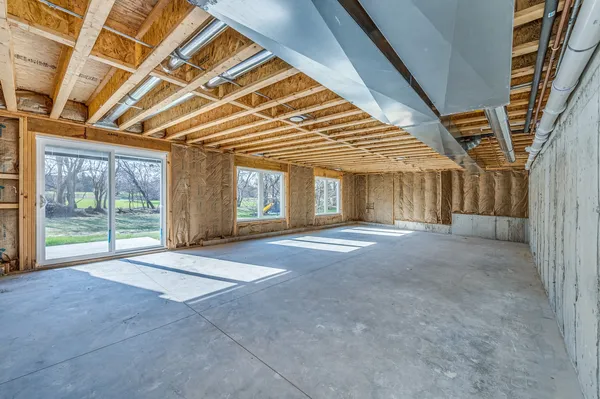 a view of an empty room with windows