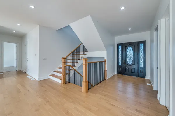 an entryway in a hall with a window