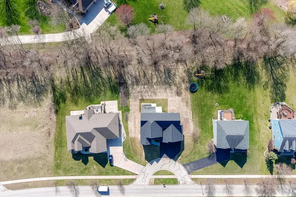 an aerial view of multiple house with outdoor space