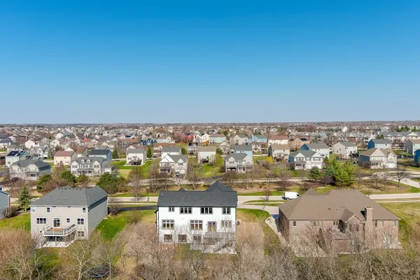 an aerial view of residential building and ocean view