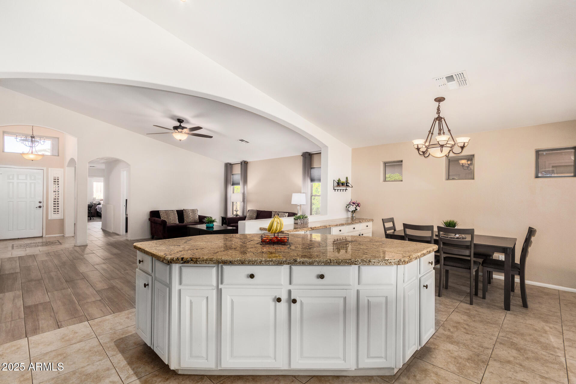 42505 West Venture Road Maricopa, AZ 85138 - Photo 2 of 11 a view of a kitchen counter top space and living room