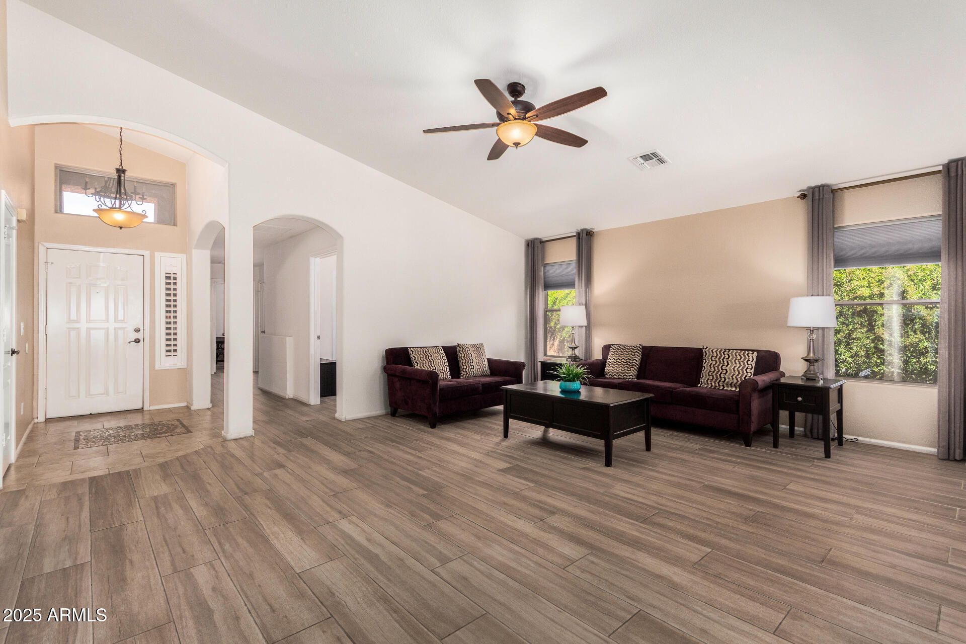 42505 West Venture Road Maricopa, AZ 85138 - Photo 5 of 11 a living room with furniture and a wooden floor