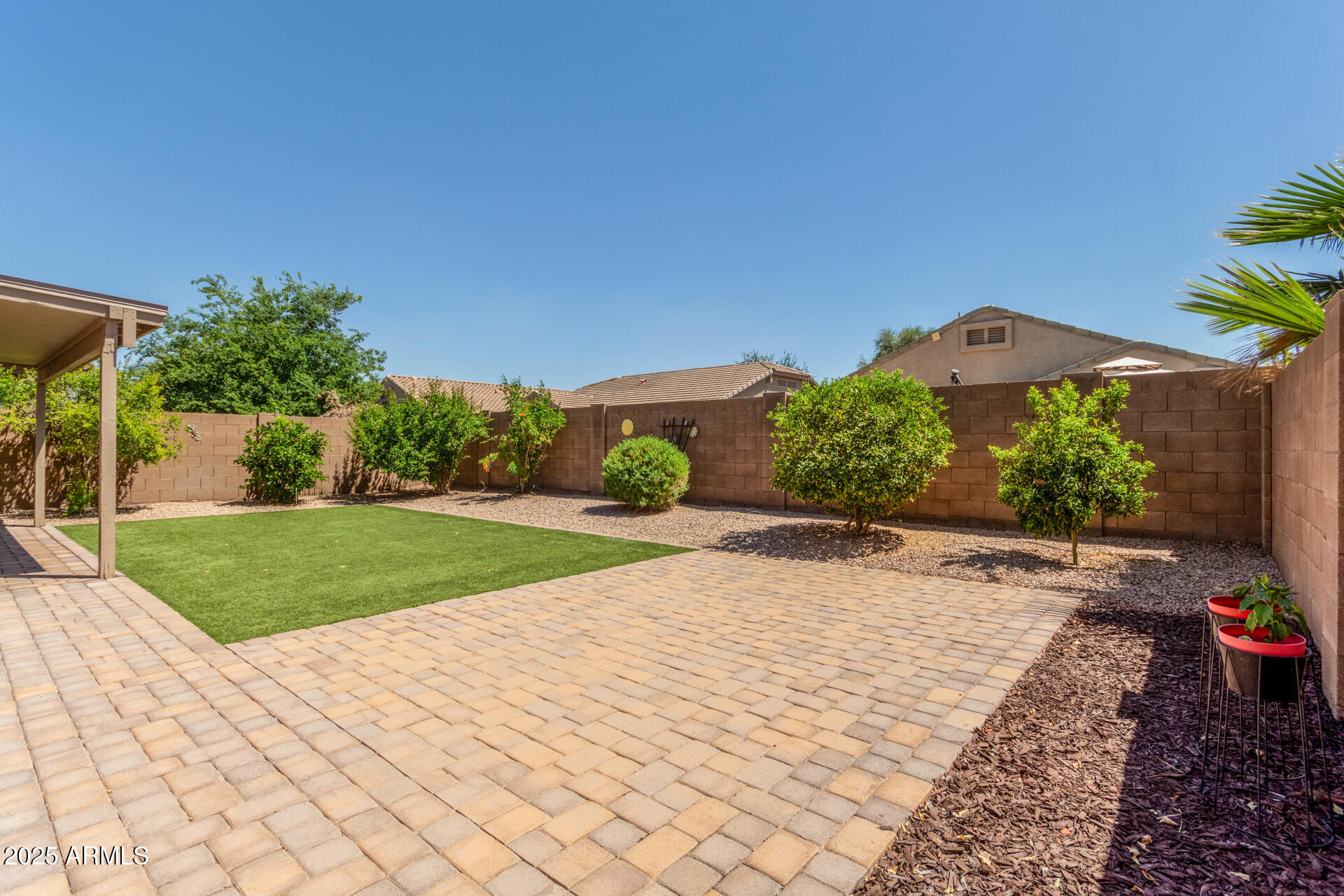 42505 West Venture Road Maricopa, AZ 85138 - Photo 9 of 11 a view of a garden with a pathway