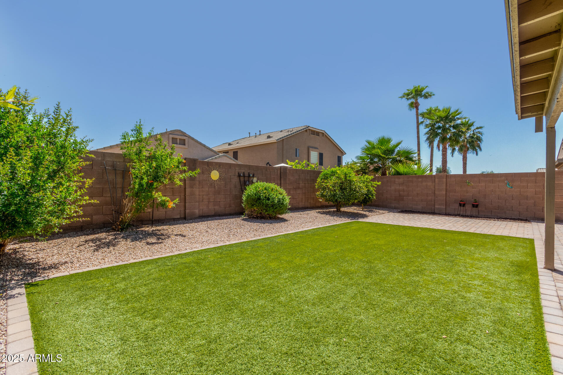 42505 West Venture Road Maricopa, AZ 85138 - Photo 10 of 11 a view of a garden with a building in the background