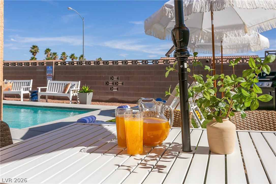 101 Beaver Ridge Avenue North Las Vegas, NV 89031 - Photo 40 of 42 An inviting pool area with ample seating, perfect for outdoor relaxation.