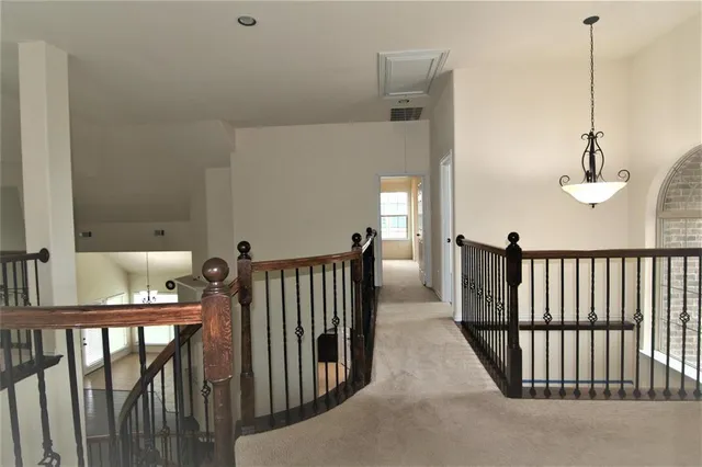 a view of a hallway with windows