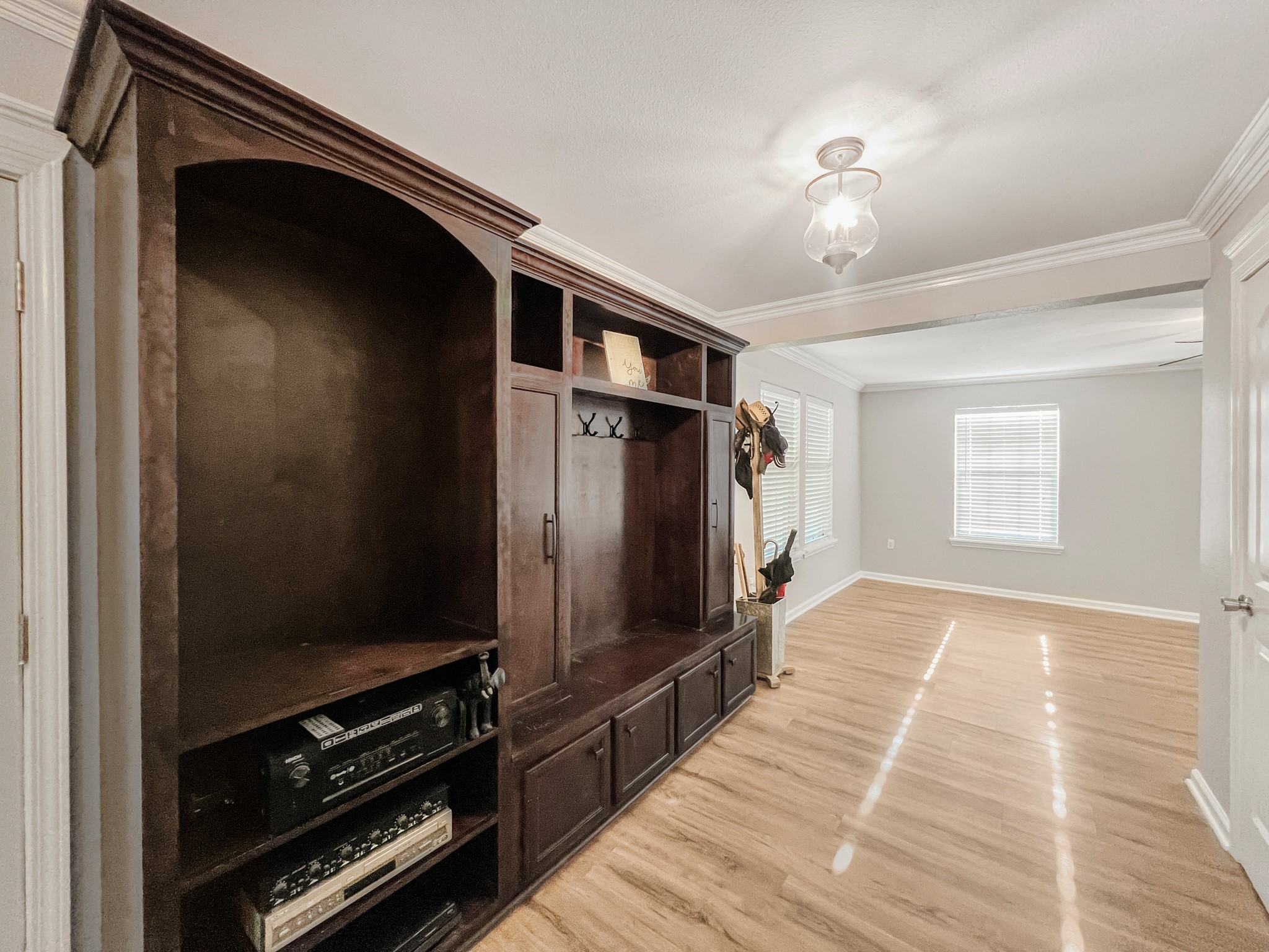 9731 Hadden Road Baytown, TX 77521 - Photo 29 of 47 a view of a hallway with wooden floor and staircase