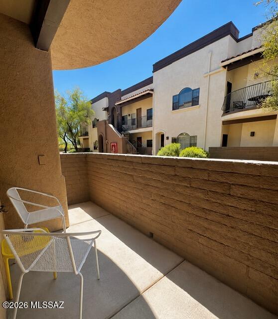 2018 East River Road, Unit 102 Tucson, AZ 85718 - Photo 22 of 25 a backyard of a house with table and chairs