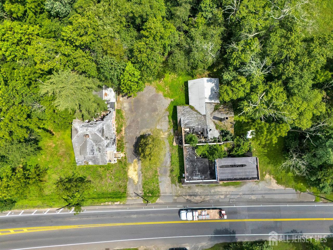 465 Lakewood Farmingdale Road Howell, NJ 07731 - Photo 11 of 17 an aerial view of a house with a yard and large tree
