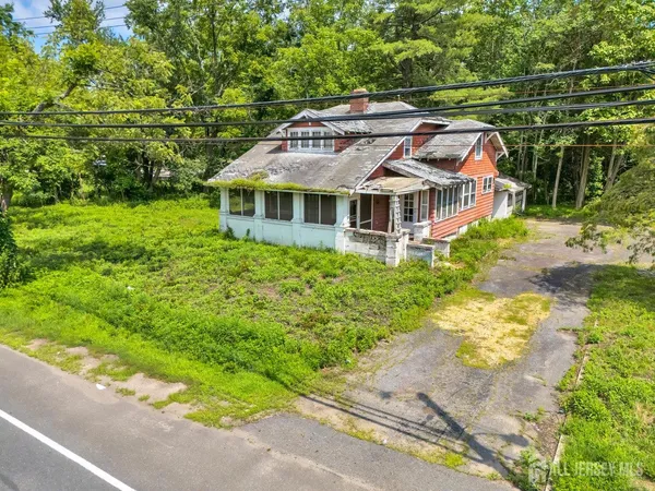 a front view of a house with a yard and porch
