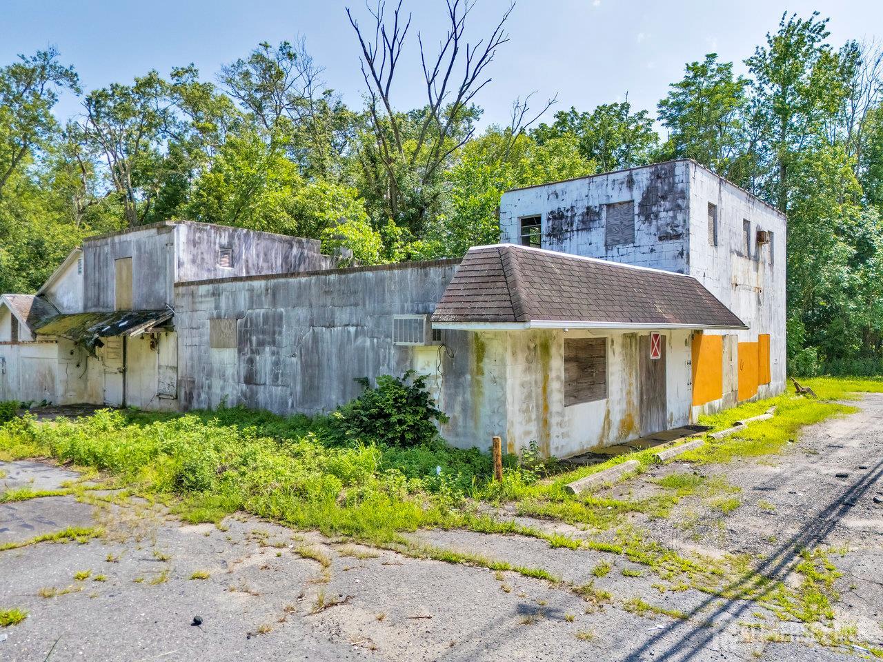 465 Lakewood Farmingdale Road Howell, NJ 07731 - Photo 15 of 17 a view of a house with a small yard plants and large tree