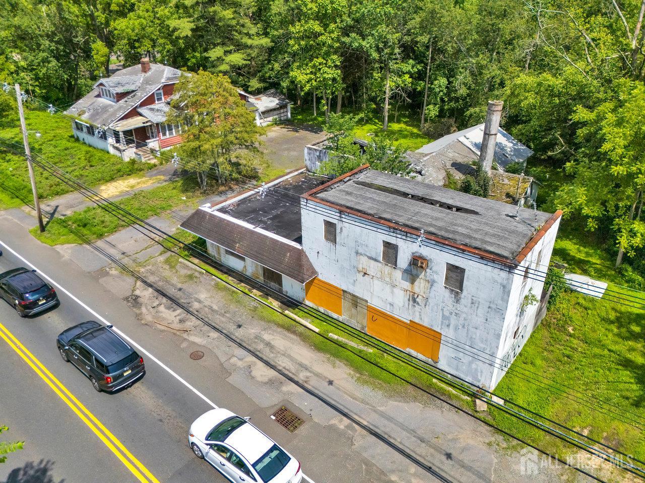 465 Lakewood Farmingdale Road Howell, NJ 07731 - Photo 2 of 17 an aerial view of a house with a yard