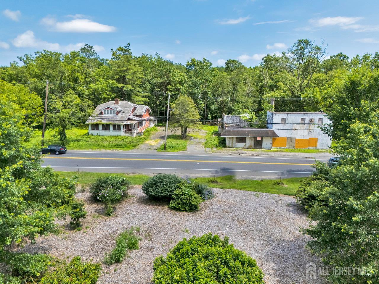 465 Lakewood Farmingdale Road Howell, NJ 07731 - Photo 3 of 17 a view of a swimming pool with a yard