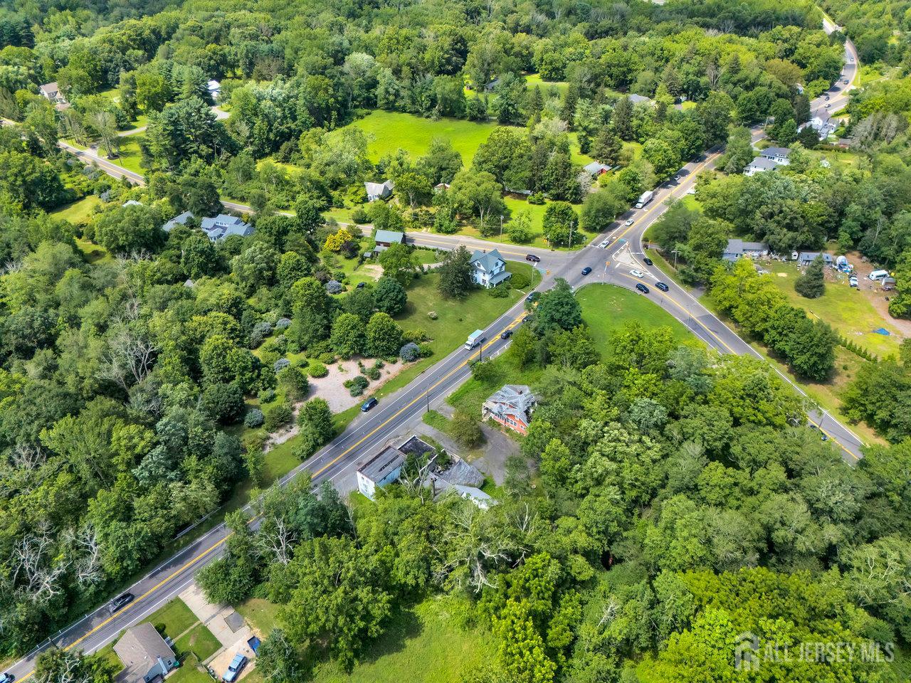 465 Lakewood Farmingdale Road Howell, NJ 07731 - Photo 9 of 17 an aerial view of residential houses with outdoor space and trees