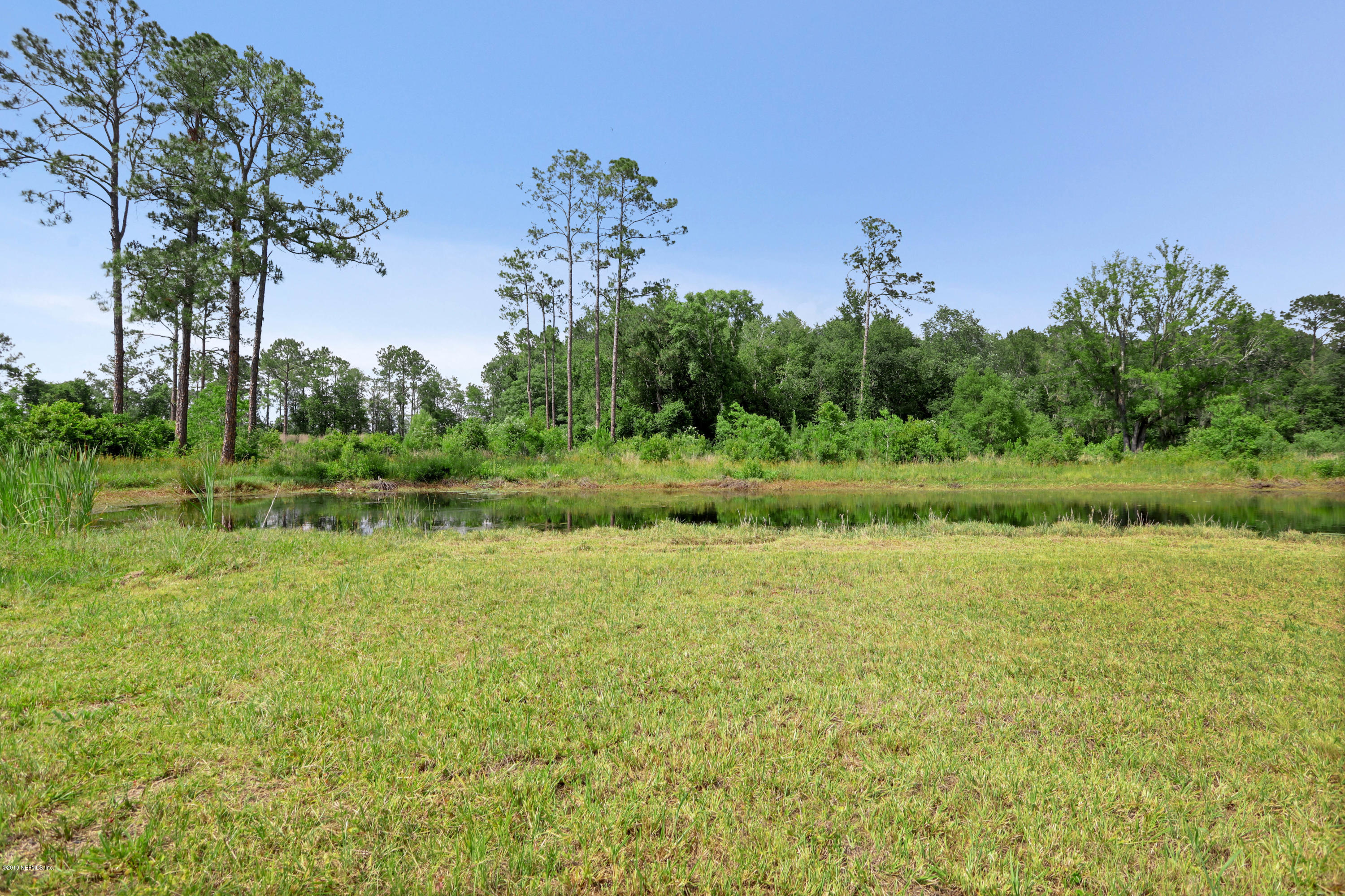 986 Bea Lane Jacksonville, FL 32220 - Photo 14 of 42 a view of a large body of water with a house in the background