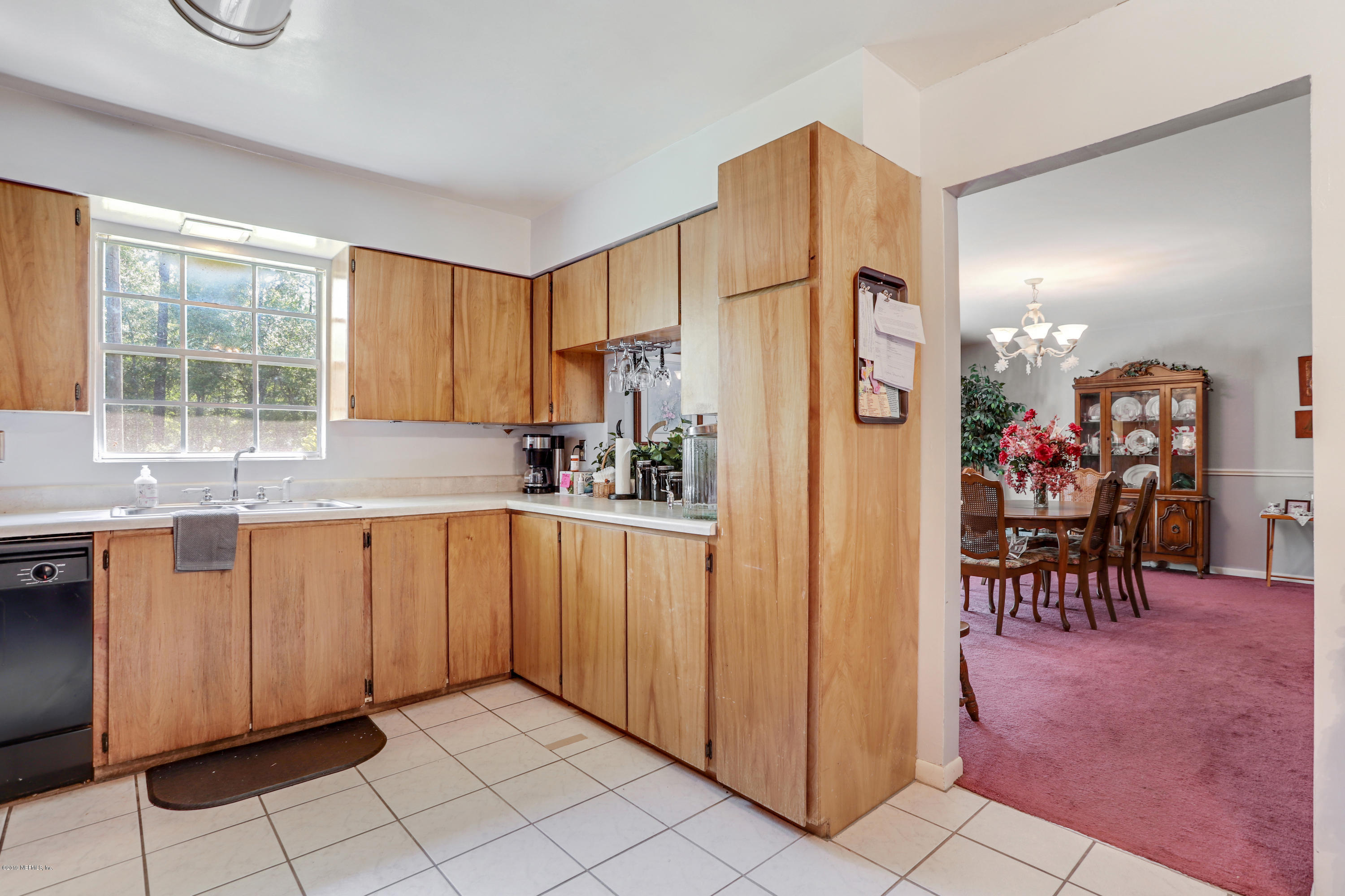 986 Bea Lane Jacksonville, FL 32220 - Photo 21 of 42 a kitchen with stainless steel appliances granite countertop a refrigerator and a sink