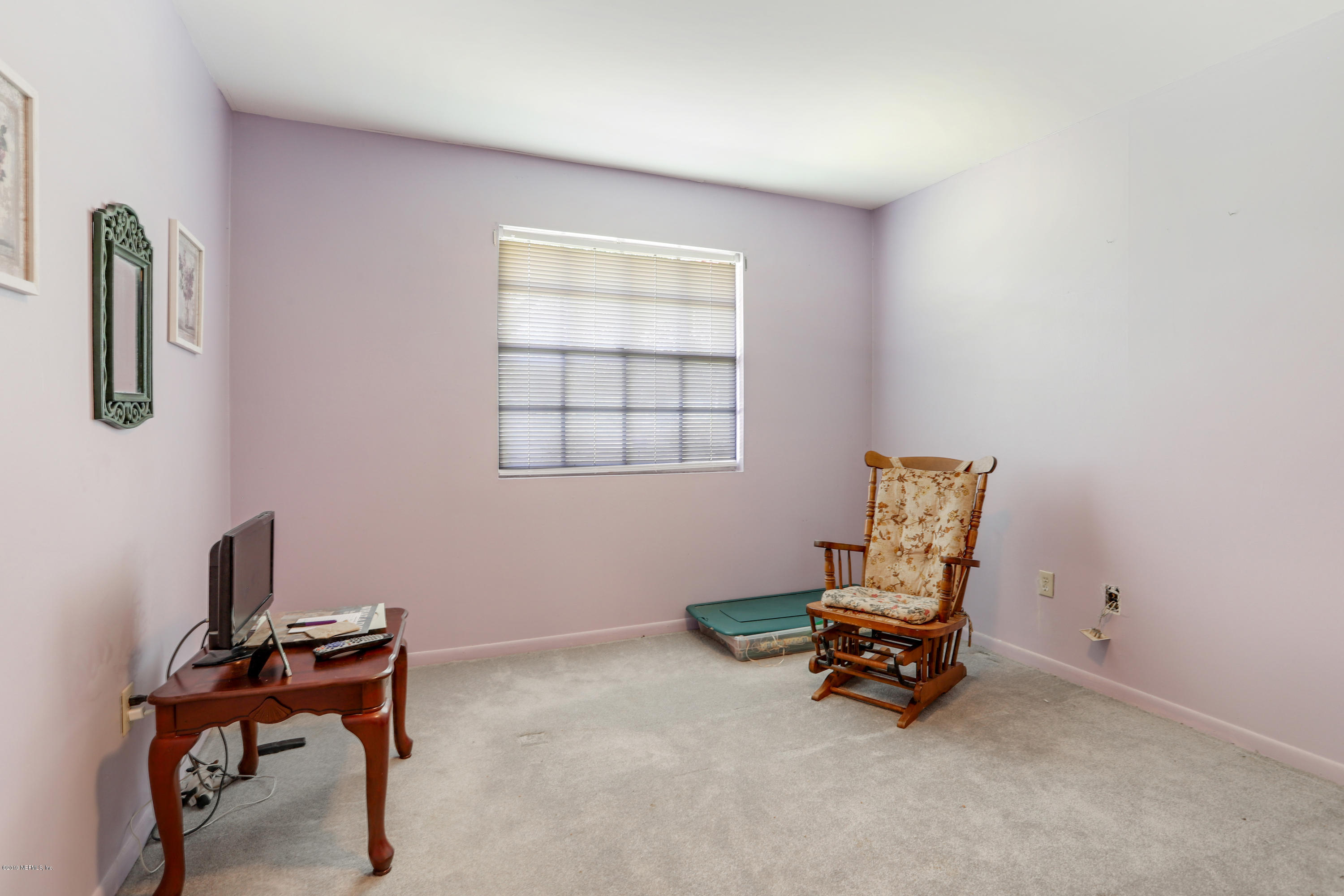 986 Bea Lane Jacksonville, FL 32220 - Photo 25 of 42 a living room with furniture and a window