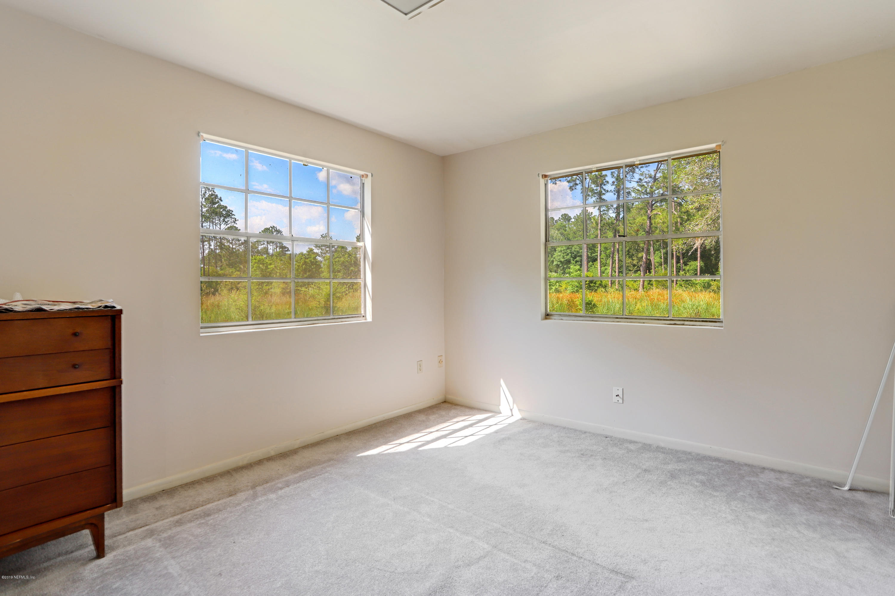 986 Bea Lane Jacksonville, FL 32220 - Photo 27 of 42 a view of an empty room with a window