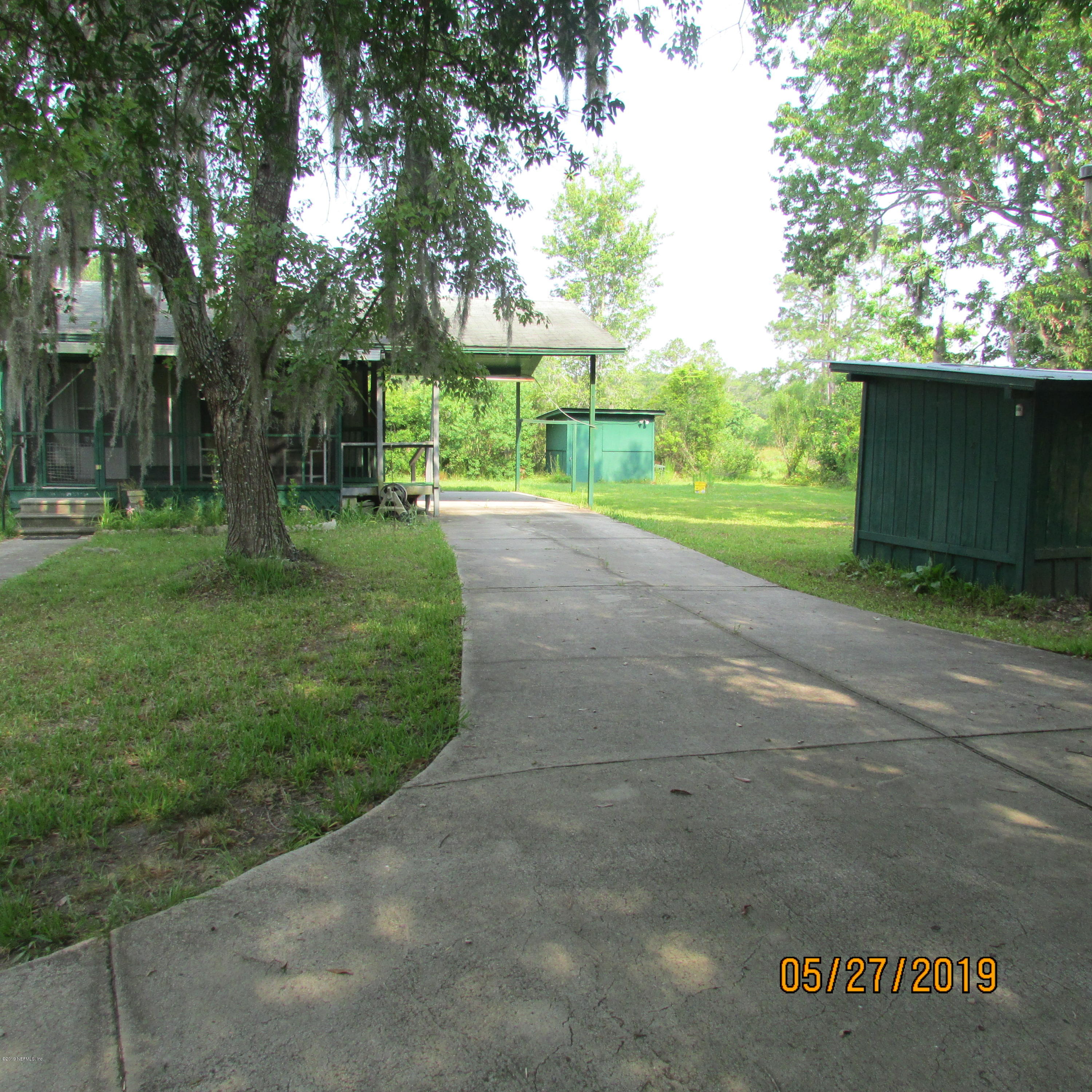 986 Bea Lane Jacksonville, FL 32220 - Photo 33 of 42 a view of a park with large trees