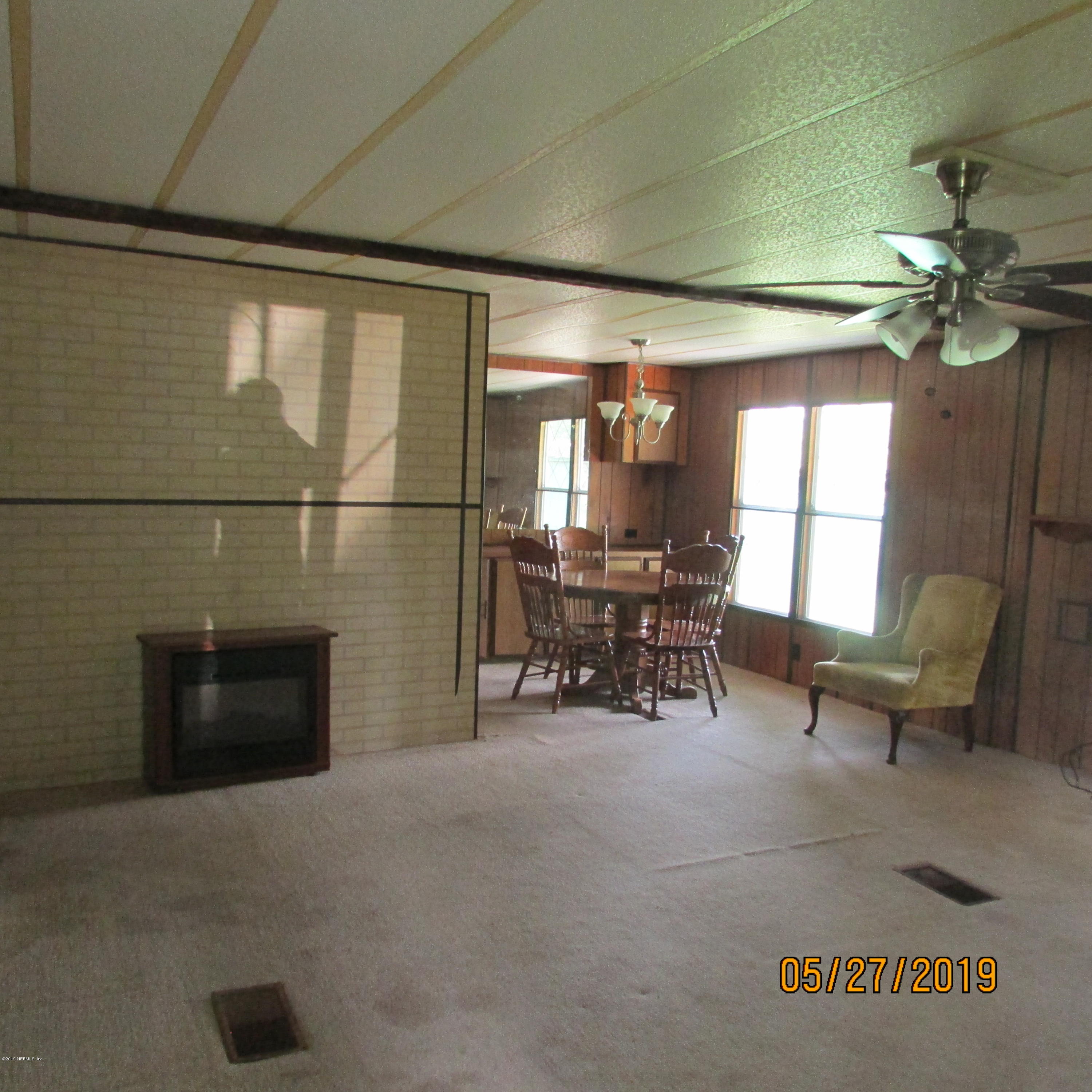 986 Bea Lane Jacksonville, FL 32220 - Photo 34 of 42 a lobby with furniture and a fireplace