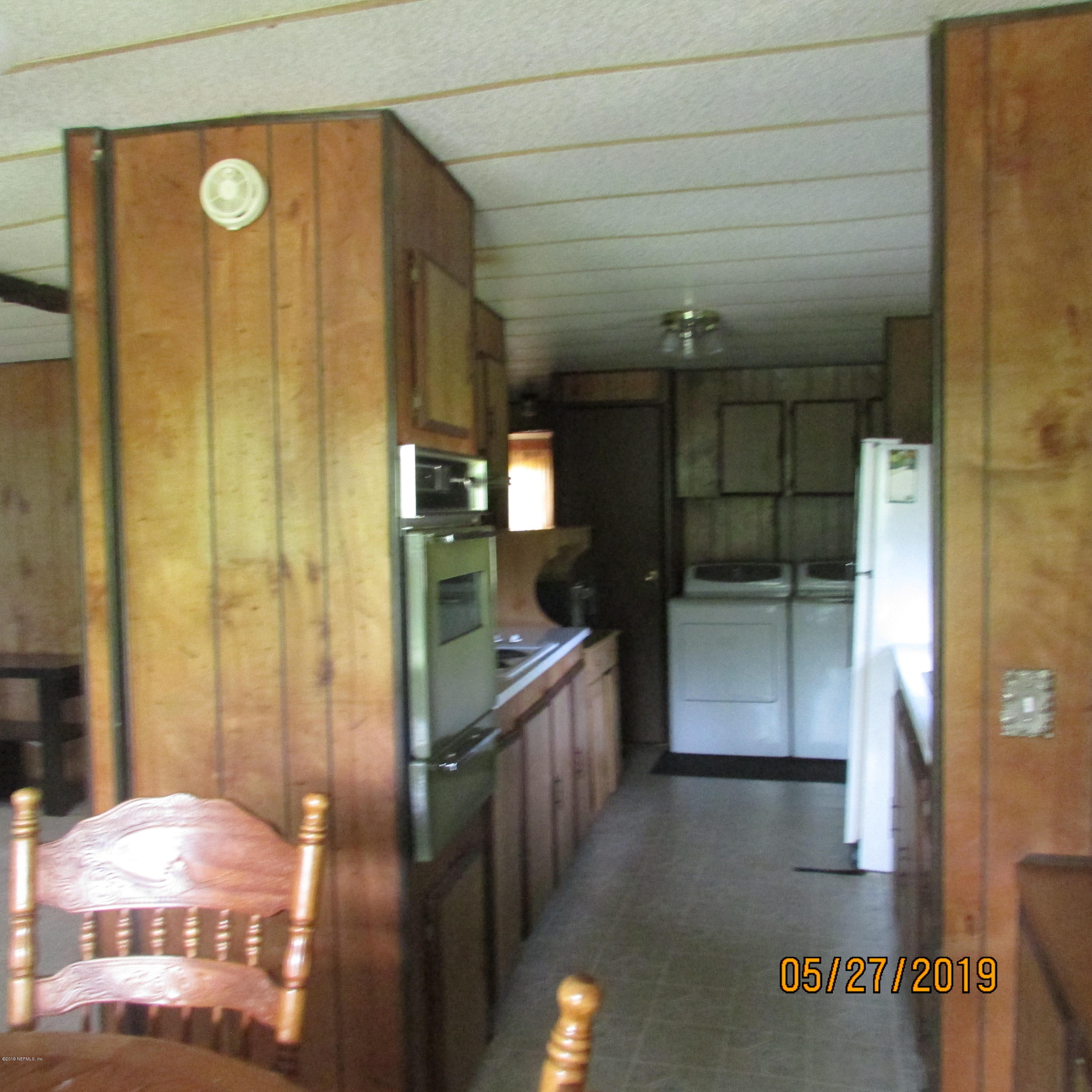986 Bea Lane Jacksonville, FL 32220 - Photo 35 of 42 a bathroom with a tub and shower