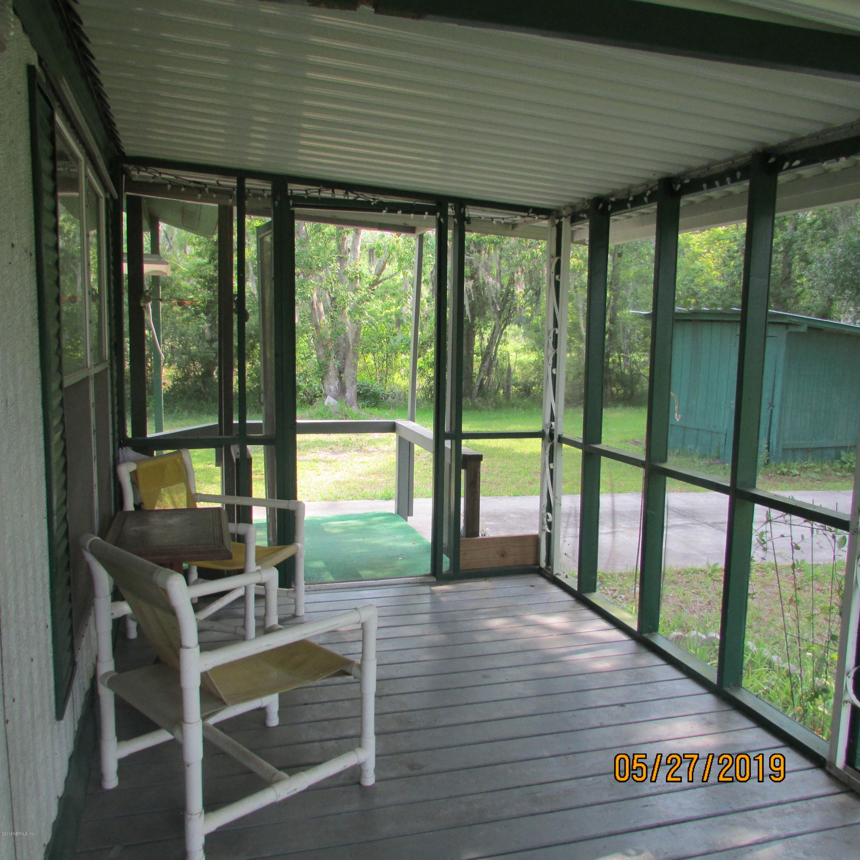 986 Bea Lane Jacksonville, FL 32220 - Photo 36 of 42 a room with balcony and wooden floor