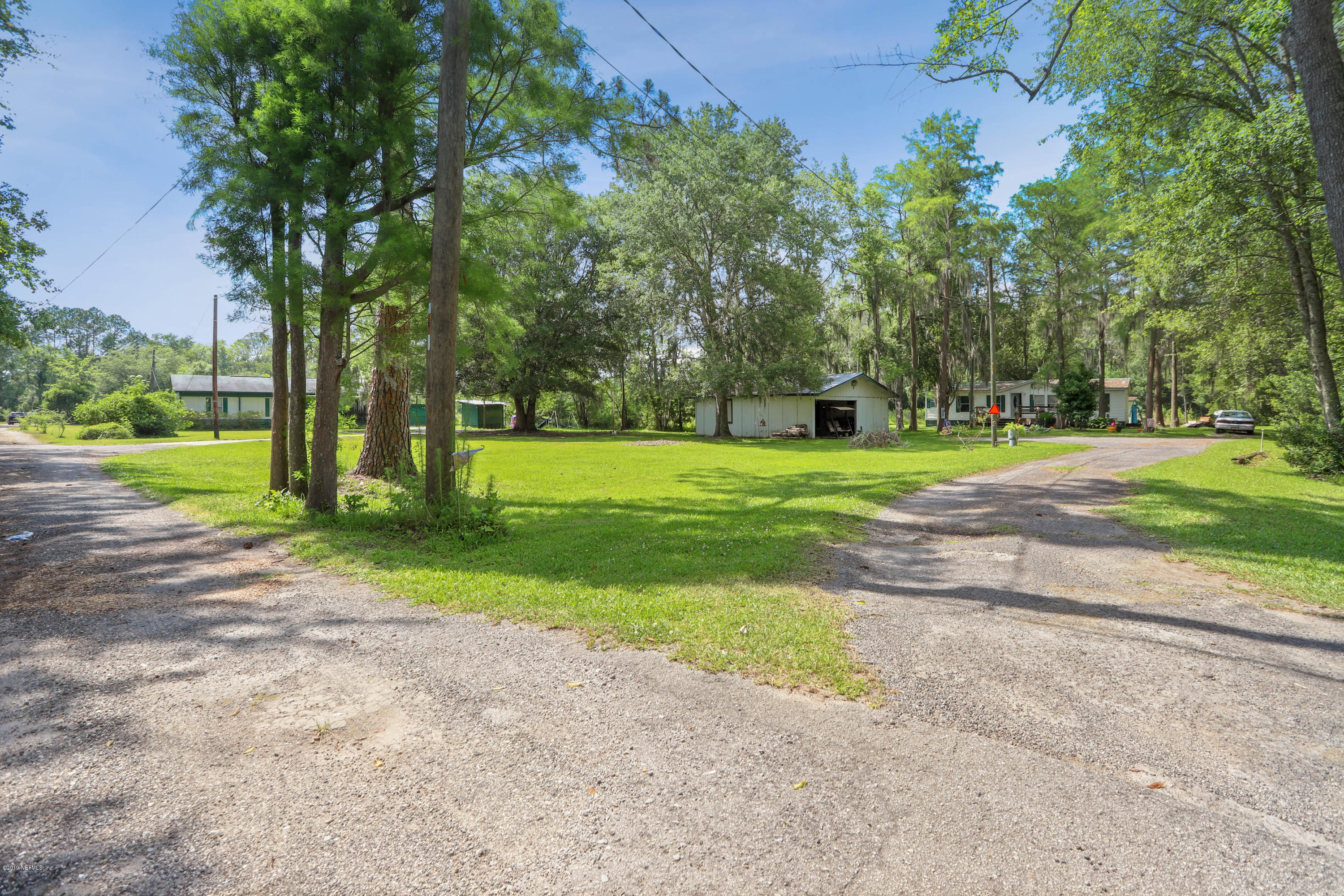 986 Bea Lane Jacksonville, FL 32220 - Photo 6 of 42 a view of a park with large trees