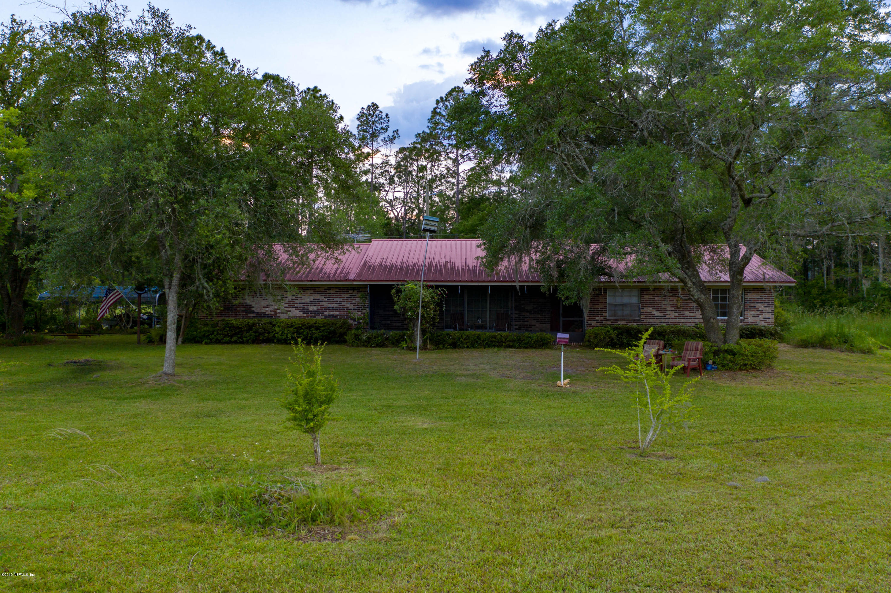 986 Bea Lane Jacksonville, FL 32220 - Photo 9 of 42 a view of a wooden deck and a yard