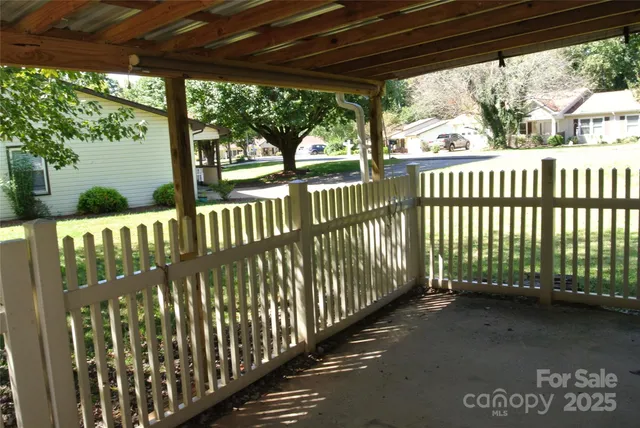 a view of a house with a yard porch and sitting area