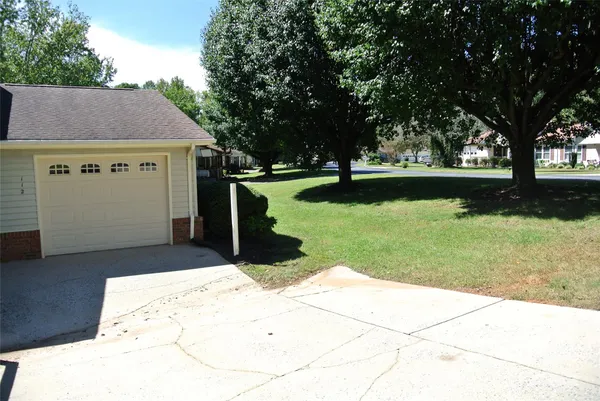 a view of backyard with green space