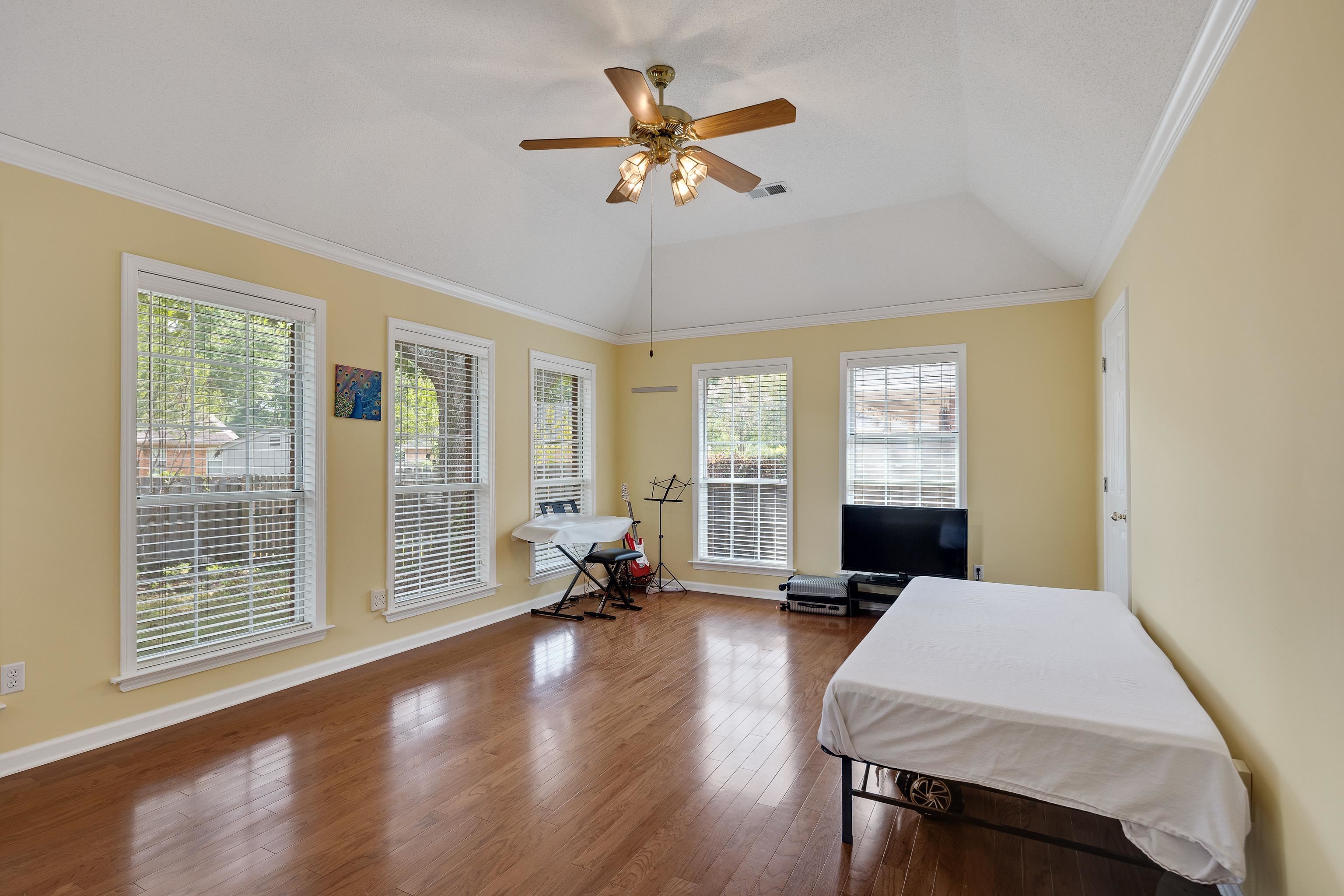 954 Wildbird Cove Collierville, TN 38017 - Photo 17 of 32 a living room with furniture large window and wooden floor