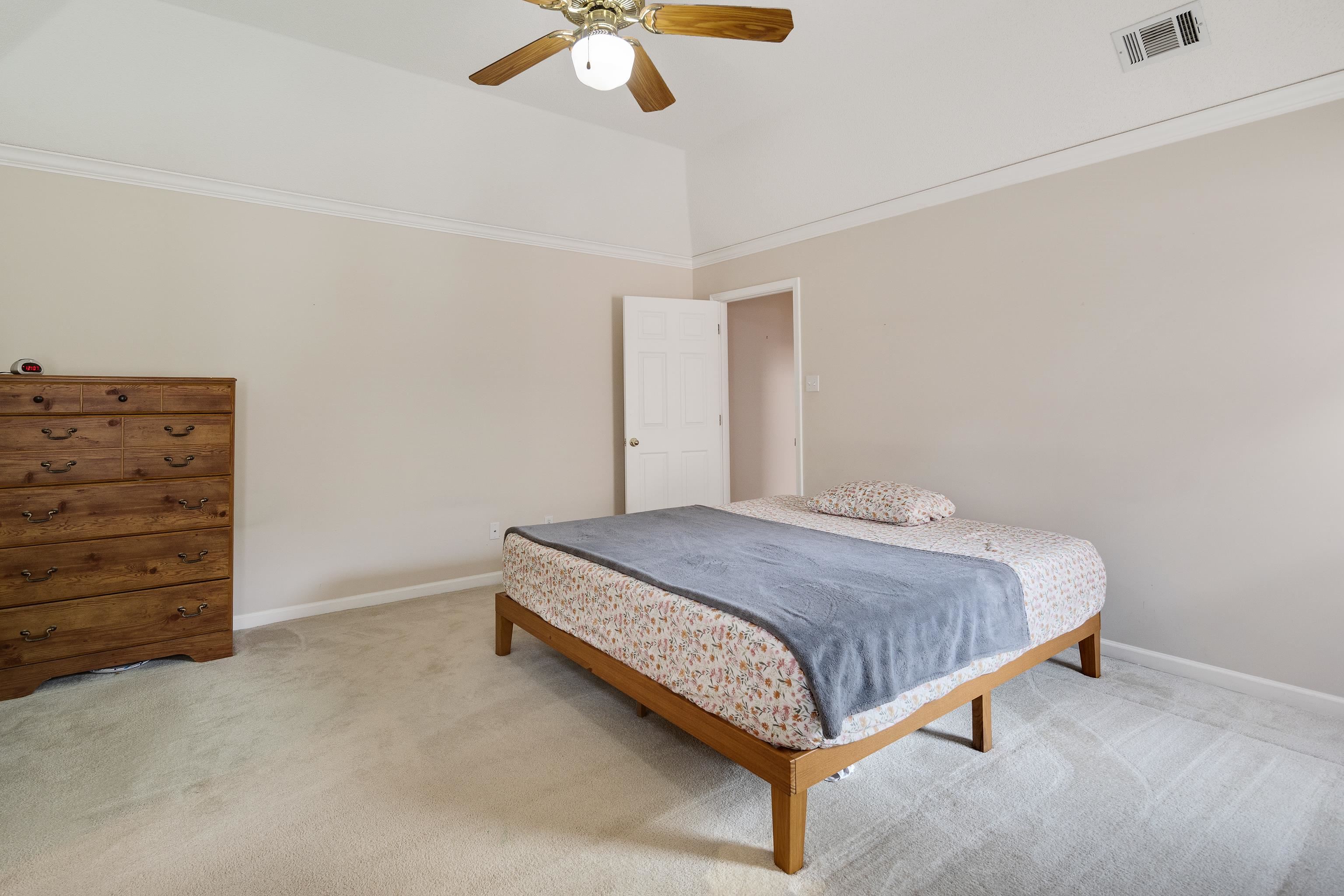 954 Wildbird Cove Collierville, TN 38017 - Photo 20 of 32 a spacious bedroom with a bed and cabinet