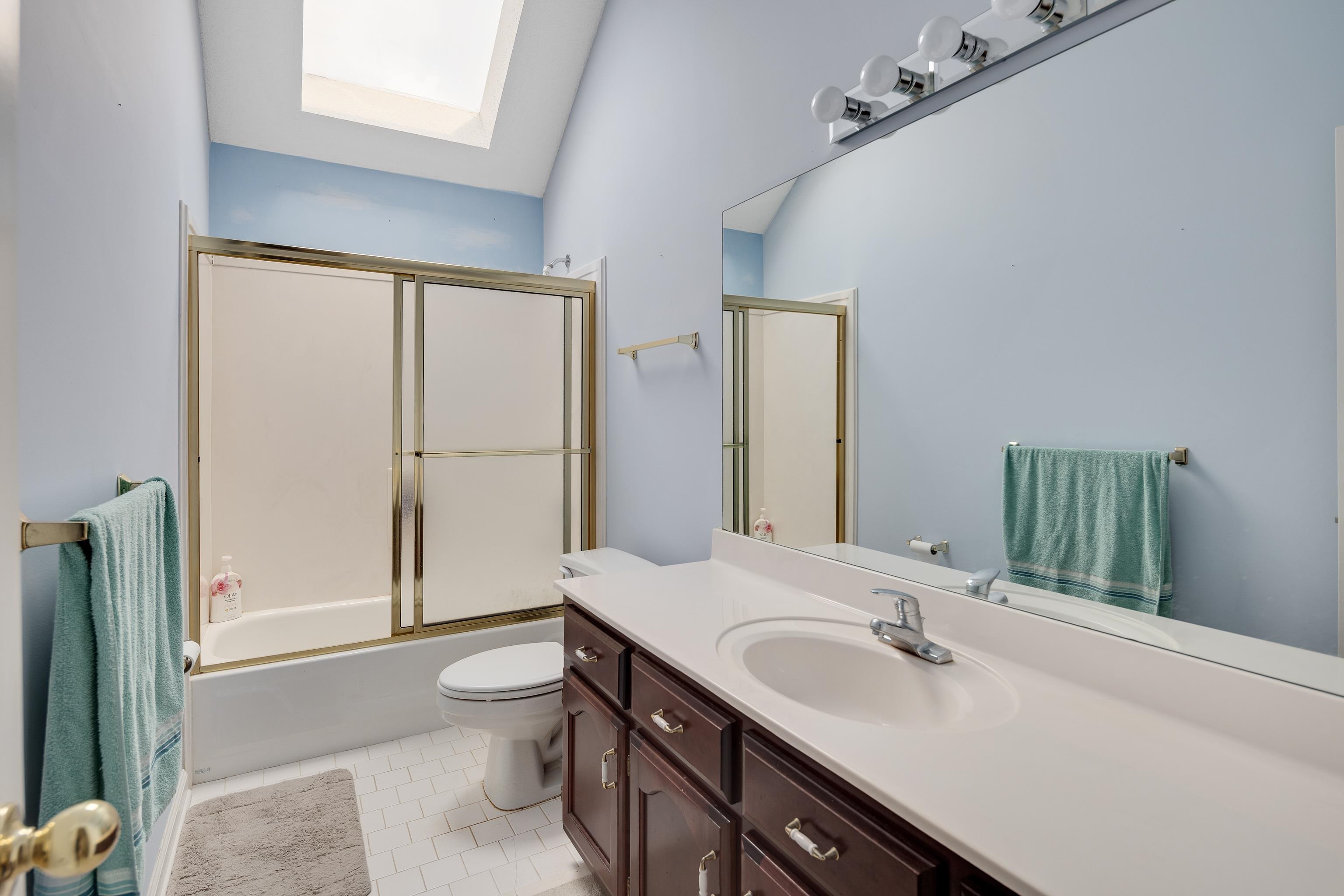 954 Wildbird Cove Collierville, TN 38017 - Photo 26 of 32 a bathroom with a sink a toilet and shower