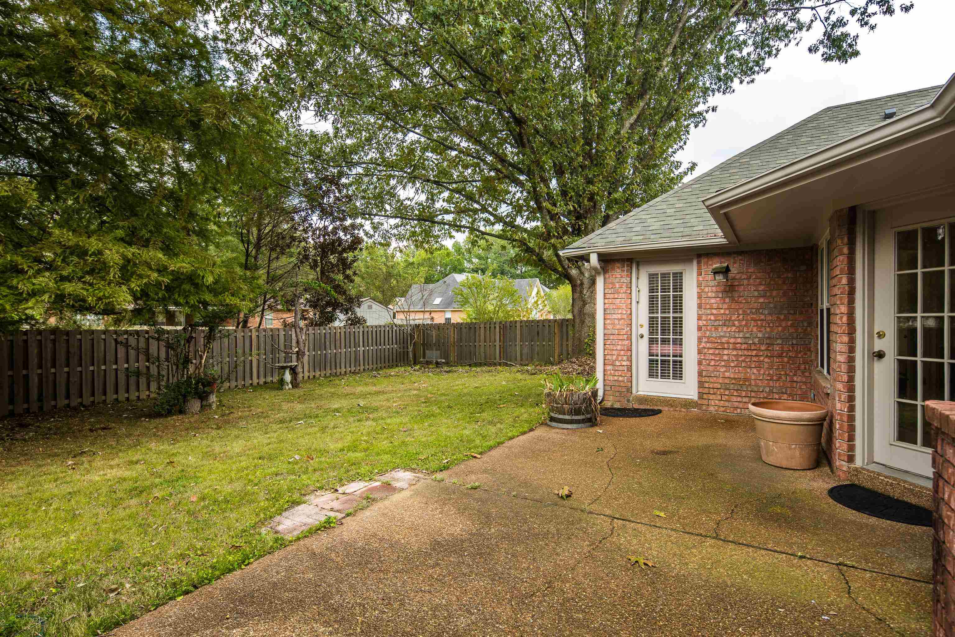 954 Wildbird Cove Collierville, TN 38017 - Photo 28 of 32 a view of a house with a yard and sitting area