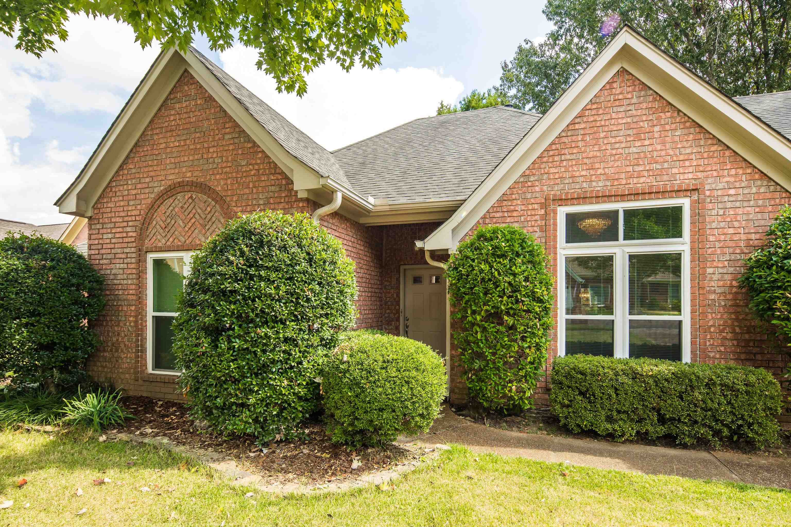 954 Wildbird Cove Collierville, TN 38017 - Photo 5 of 32 a view of a house with potted plants