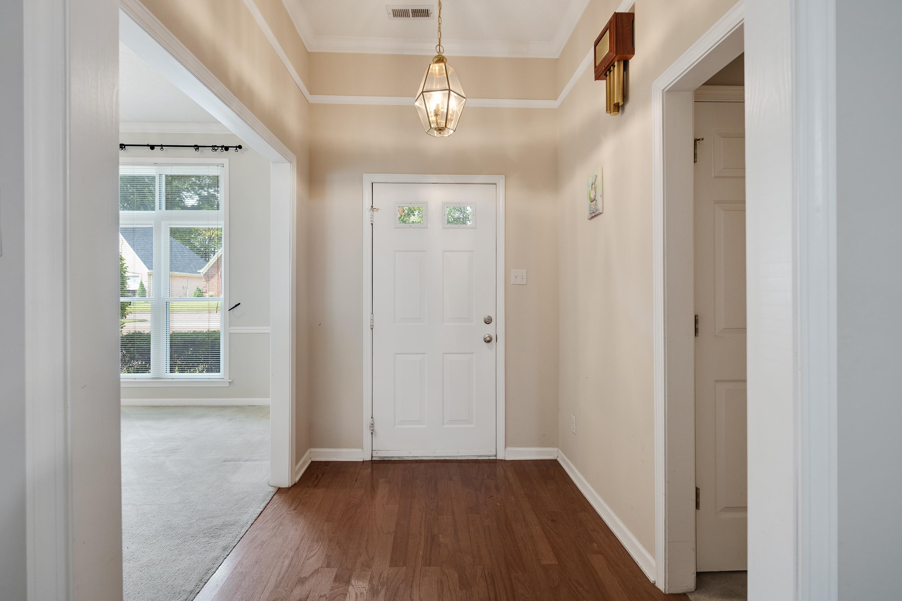 954 Wildbird Cove Collierville, TN 38017 - Photo 6 of 32 a view of empty room with wooden floor and fan
