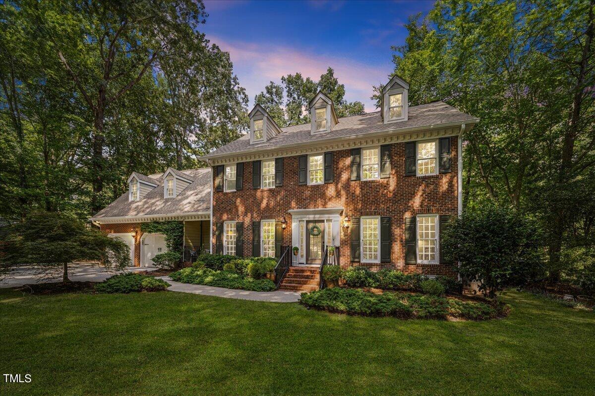 10036 Old Warden Road Raleigh, NC 27615 - Photo 1 of 42 a front view of a house with a yard
