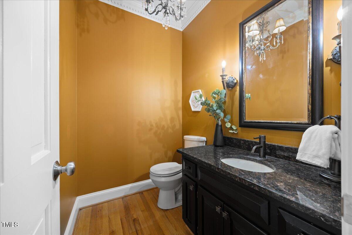 10036 Old Warden Road Raleigh, NC 27615 - Photo 14 of 42 a bathroom with a granite countertop sink and a mirror