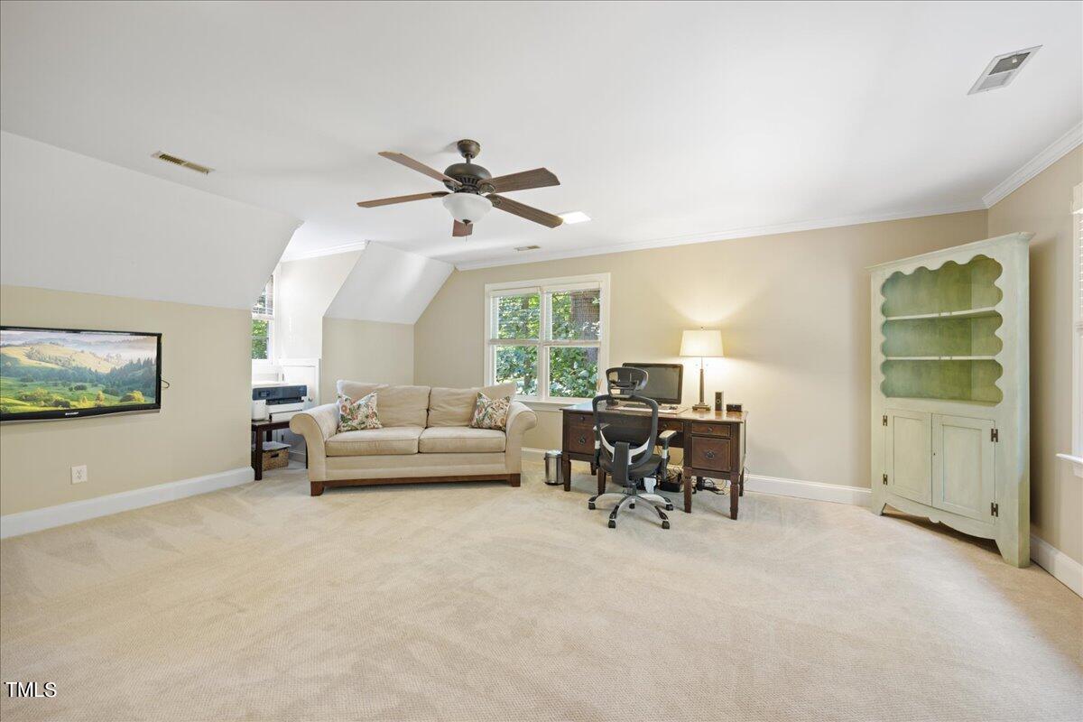 10036 Old Warden Road Raleigh, NC 27615 - Photo 32 of 42 a living room with furniture and a window