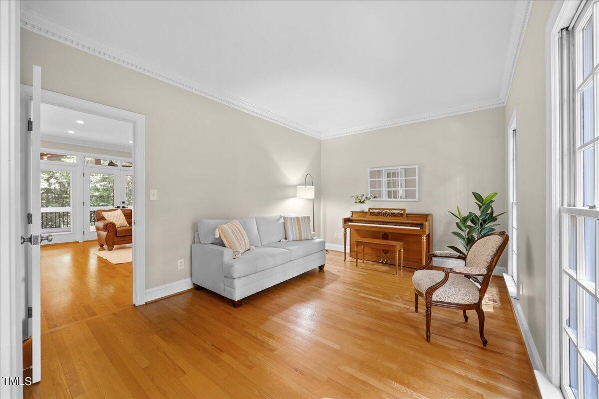 10036 Old Warden Road Raleigh, NC 27615 - Photo 7 of 42 a living room with furniture and a wooden floor