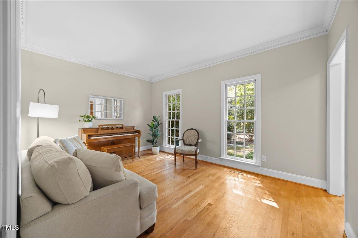 10036 Old Warden Road Raleigh, NC 27615 - Photo 8 of 42 a living room with furniture and a window